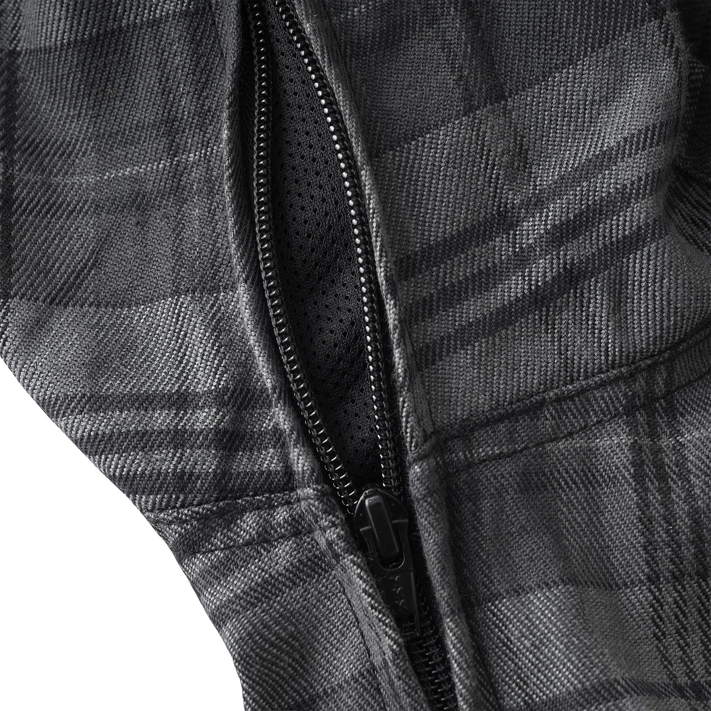Close-up of a black and gray plaid zippered jacket showing the textured fabric, zipper track, and black mesh lining.