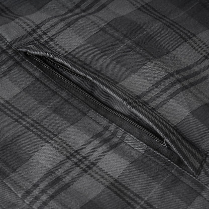 Close-up of a dark gray and black plaid fabric with a diagonal zippered pocket.